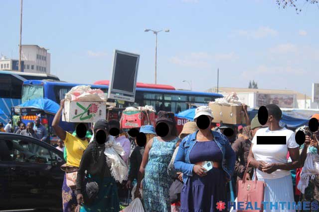 Femalevendors selling their wares at the Fourth Street bus terminus now known as Simon Muzenda Stree